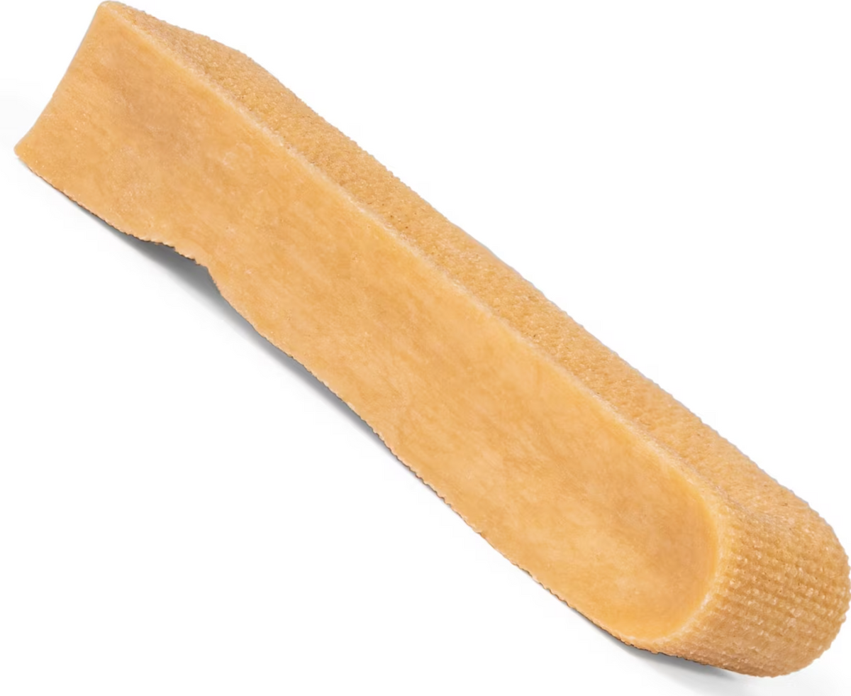 Single tan rectangular Himalayan yak cheese dog chew with a textured surface, shown at an angle on a white background.