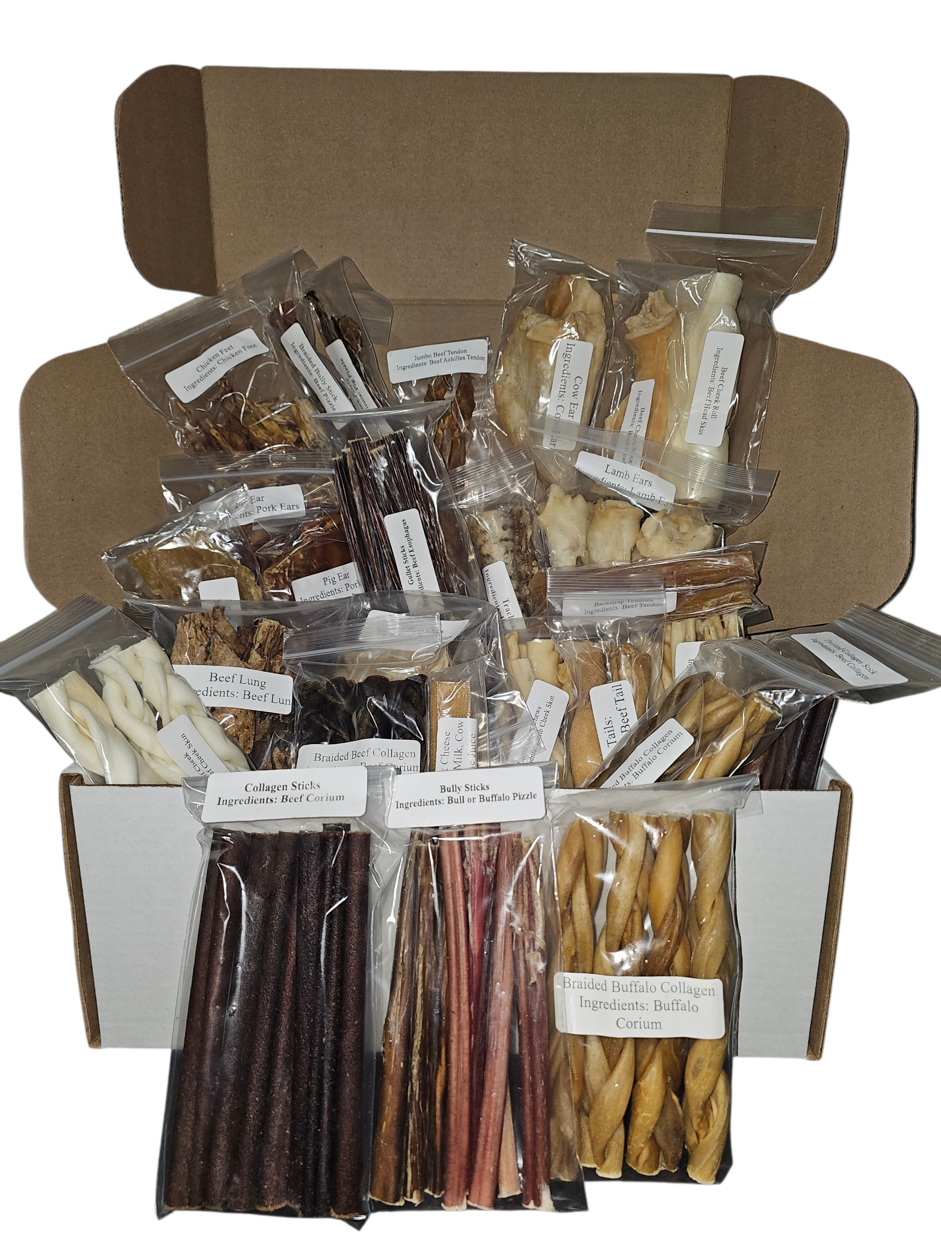 Assorted dog chews in plastic bags inside a cardboard box, including Bully Sticks and Braided Buffalo Collagen.